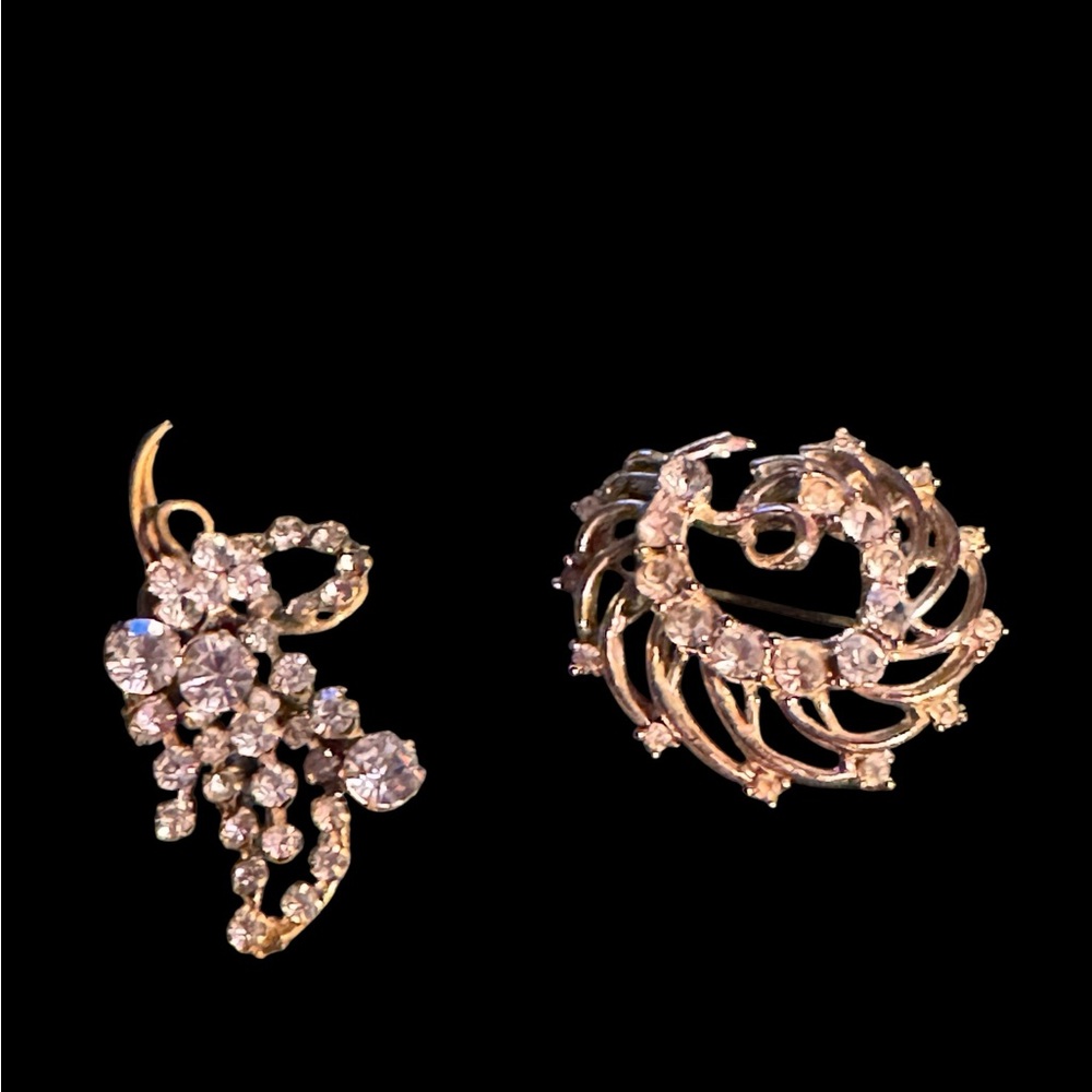 Two crystal brooches